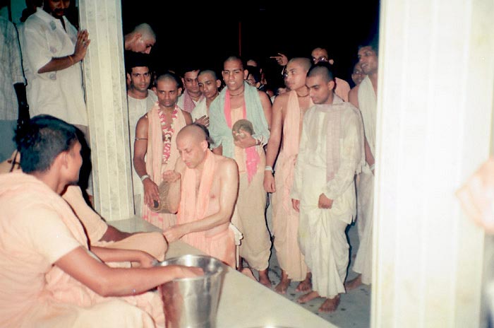 Radhanath Swami Serving Devotees
