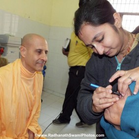 Radhanath Swami Observing Patient being Treated RadhanathSwamiinBarsanaEyeCampFebruary2012297 new 283x283 Radhanath Swami At Barsana Camp 2012