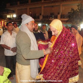 Radhanath Swami with Devotee RadhanathSwamiinBarsanaEyeCampFebruary2012720 new 283x283 Radhanath Swami At Barsana Camp 2012