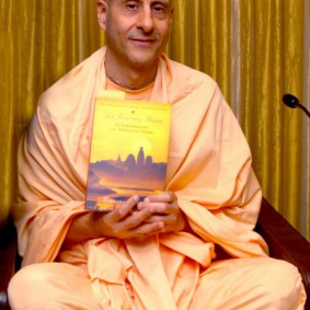 Radhanath Swami holding Journey Home 283x283 Radhanath Swami Special Moments