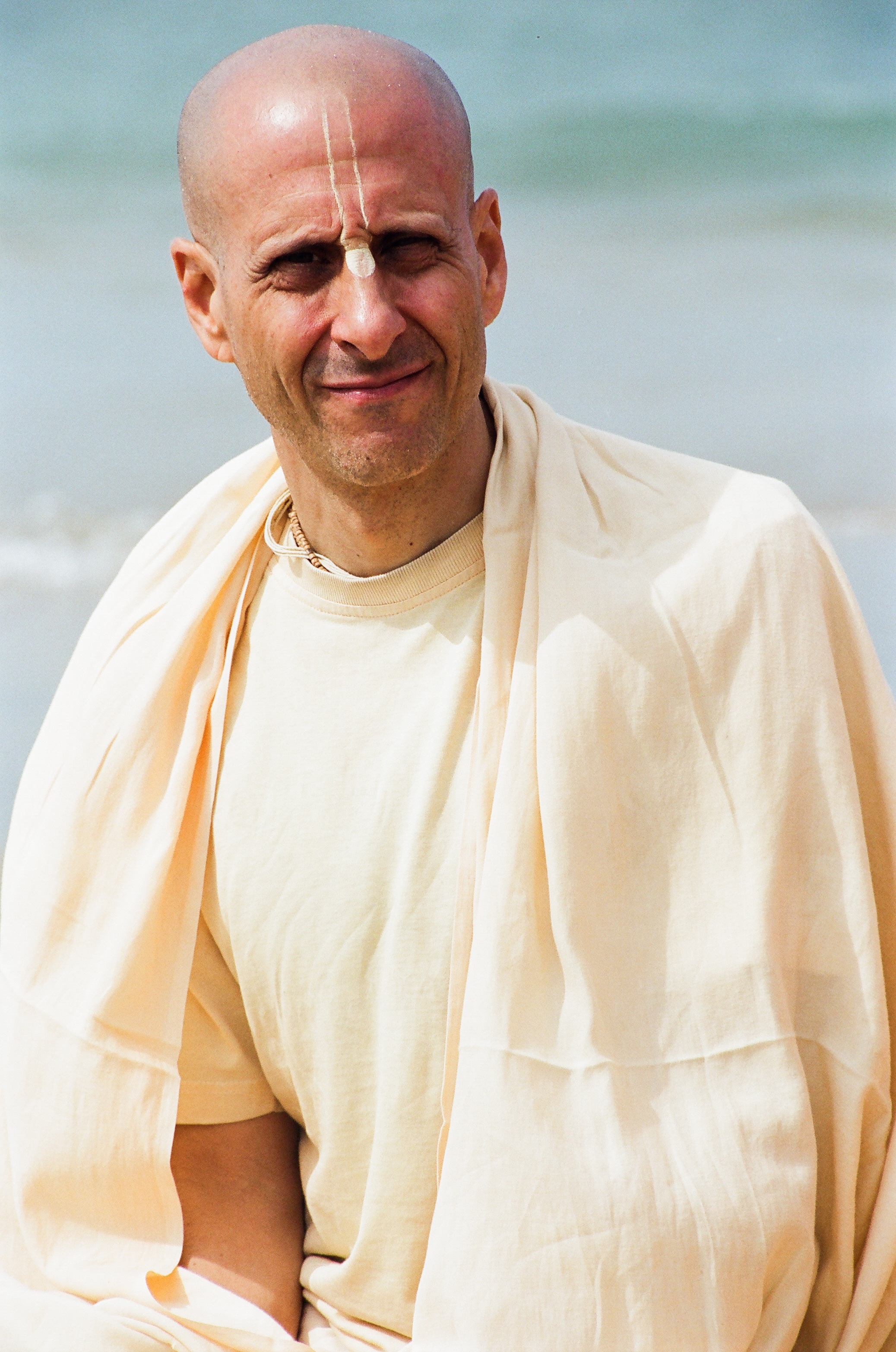 Radhanath Swami Sitting on a Beach during South India Yatra