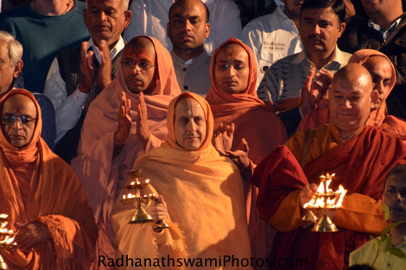 Radhanath Swami doing arati to Mother Ganges