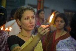 Devotee offering lamp to Lord Damodara