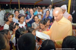 Radhanath Swami seeing the art by devotee children