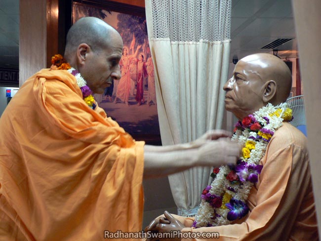 Radhanath Swami Garlanding The Deity Of Srila Prabhupada