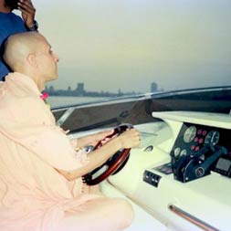 Radhanath Swami driving a Boat