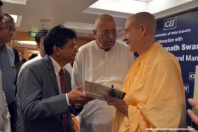 Radhanath Swami signs his book the Journey Home