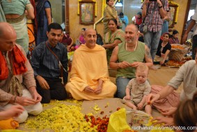 Radhanath Swami and Raghunath while plucking flower petals