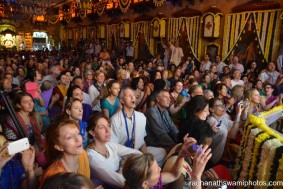 People watching flower abhishek for the dieties - Radhanath Swami