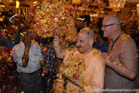 Radhanath Swami throwing flower petals
