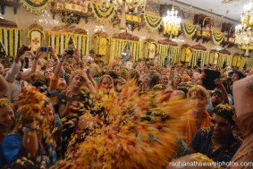 Yoga people throwing flower petals among each other - Radhanath Swami