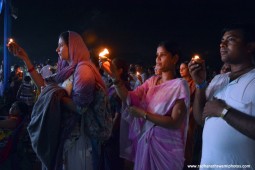 Devotees offering lamp to Lord Damodara