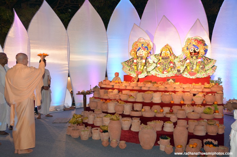 Radhanath Swami doing Arati to their lordships