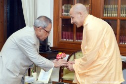 Radhanath Swami gifting Journey Home Book to President