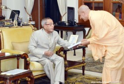 Radhanath Swami gifting Journey Home Book to President