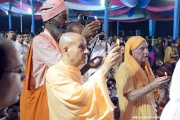 Radhanath Swami offering lamp to Lord Damodara